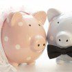 Pink and blue pig ornaments dressed like bride and groom